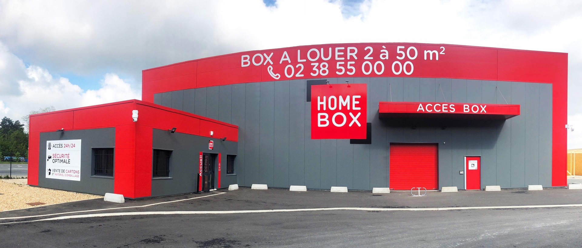 Red and grey warehouse facade with large HOMEBOX sign and box rental banner at HOMEBOX Orléans Sud, 6 Route de Concyr, Orléans