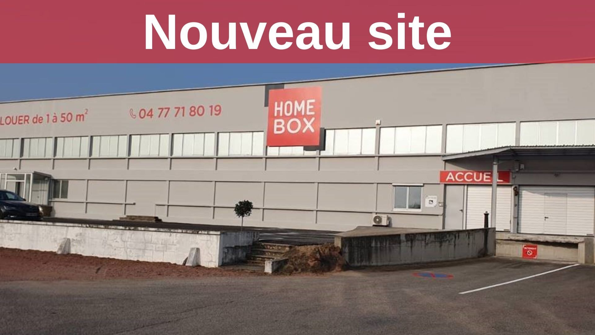 Long grey storage warehouse facade with HOMEBOX signage and reception entrance at HOMEBOX Roanne, 213 Rue de Charlieu, Roanne