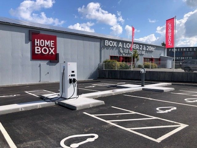 Electric vehicle charging station on parking with HOMEBOX flags at HOMEBOX Vannes Ouest, 9 rue des Glénans, Ploeren